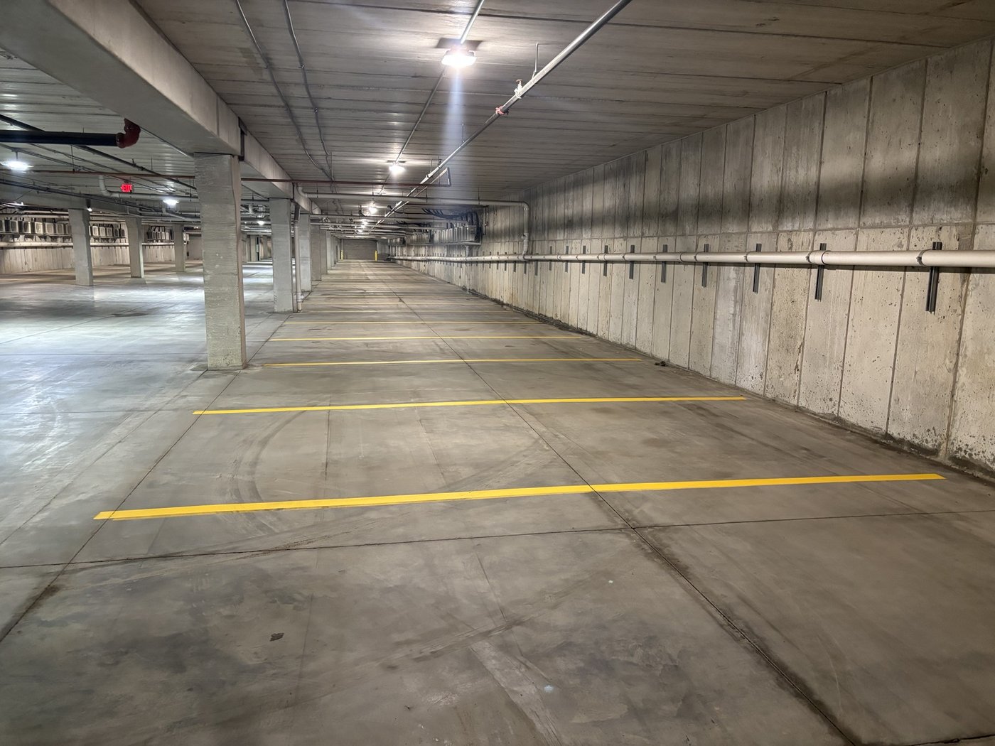 Indoor parking garage long hallway view