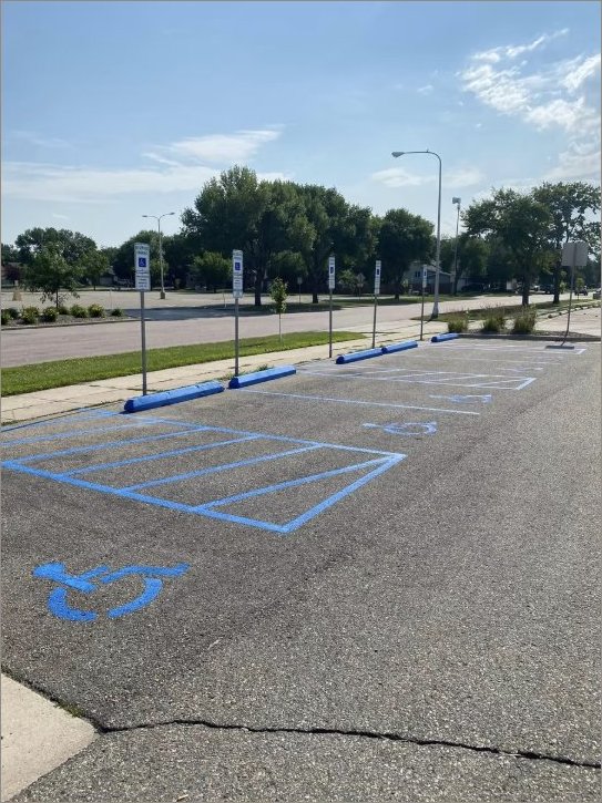 Municipal park lot with curb and accessible markings