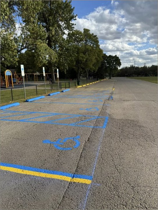 Municipal park lot with ADA accessible parking spaces