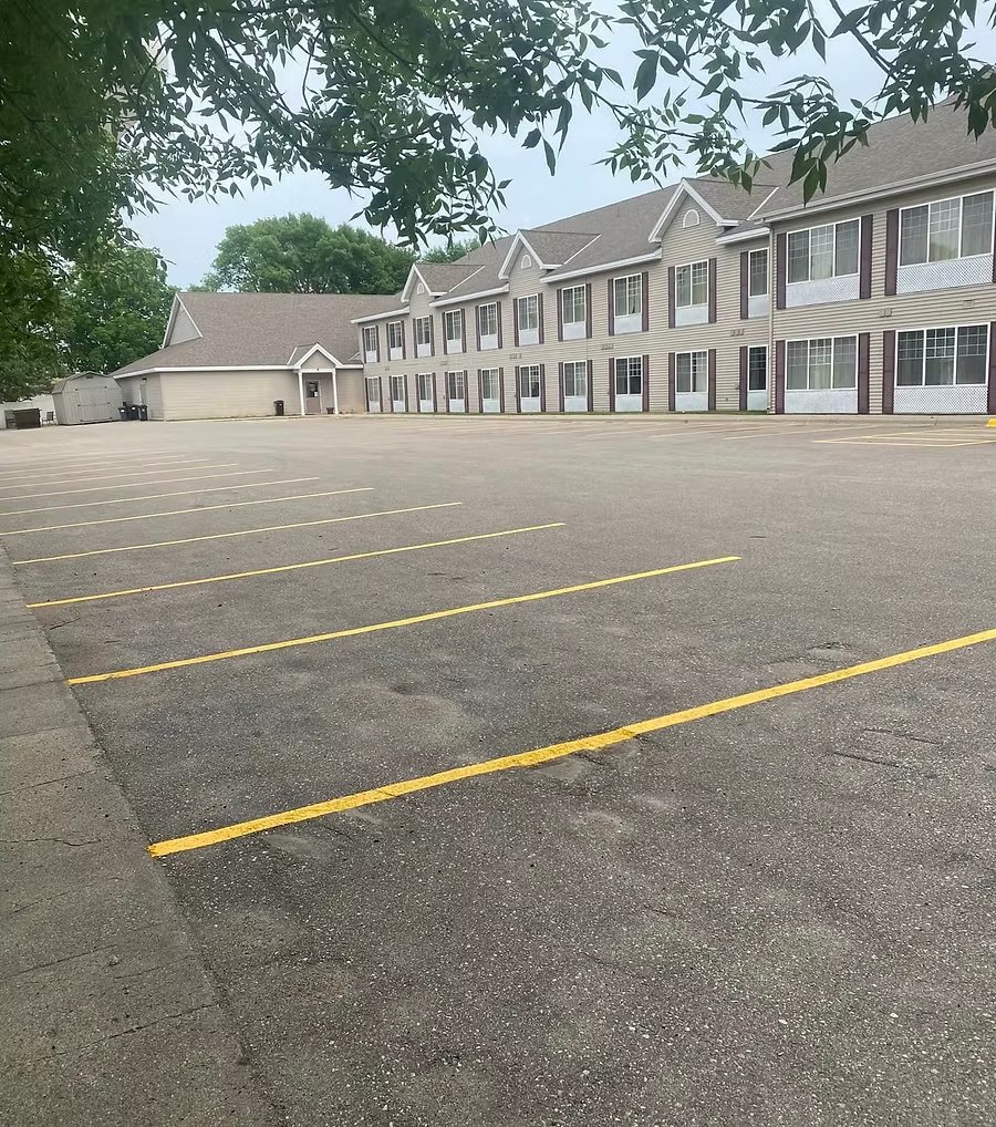 Freshly re-striped hotel parking lot with crisp yellow lines