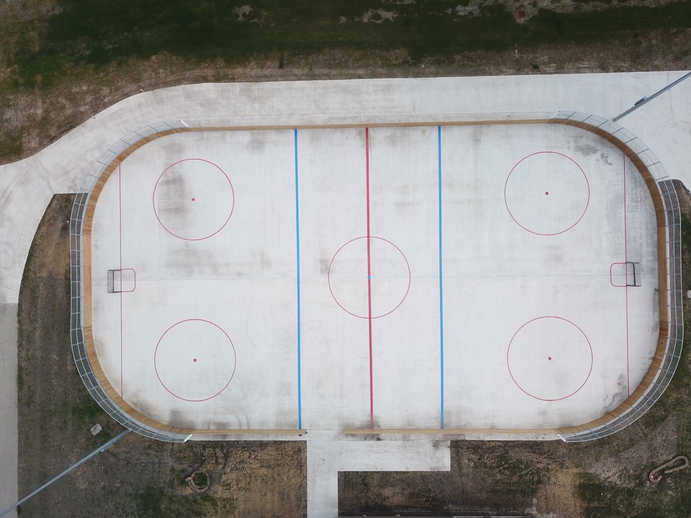 Drone view of finished hockey rink with center face-off and zones