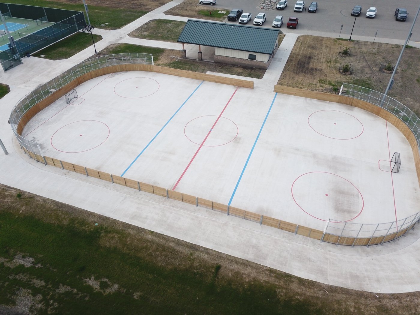 Aerial view of outdoor hockey rink with fresh red and blue lines