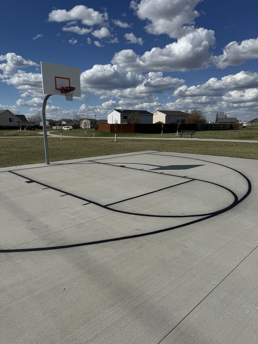 Outdoor basketball court with crisp black lines