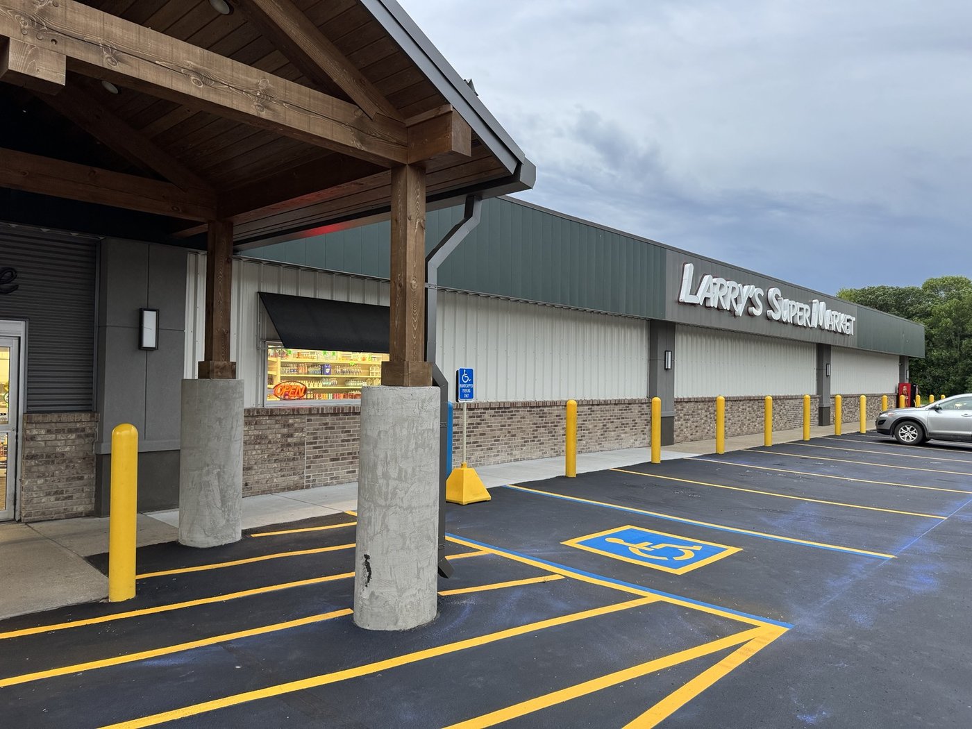 Grocery store fresh striping with yellow lines and ADA markings