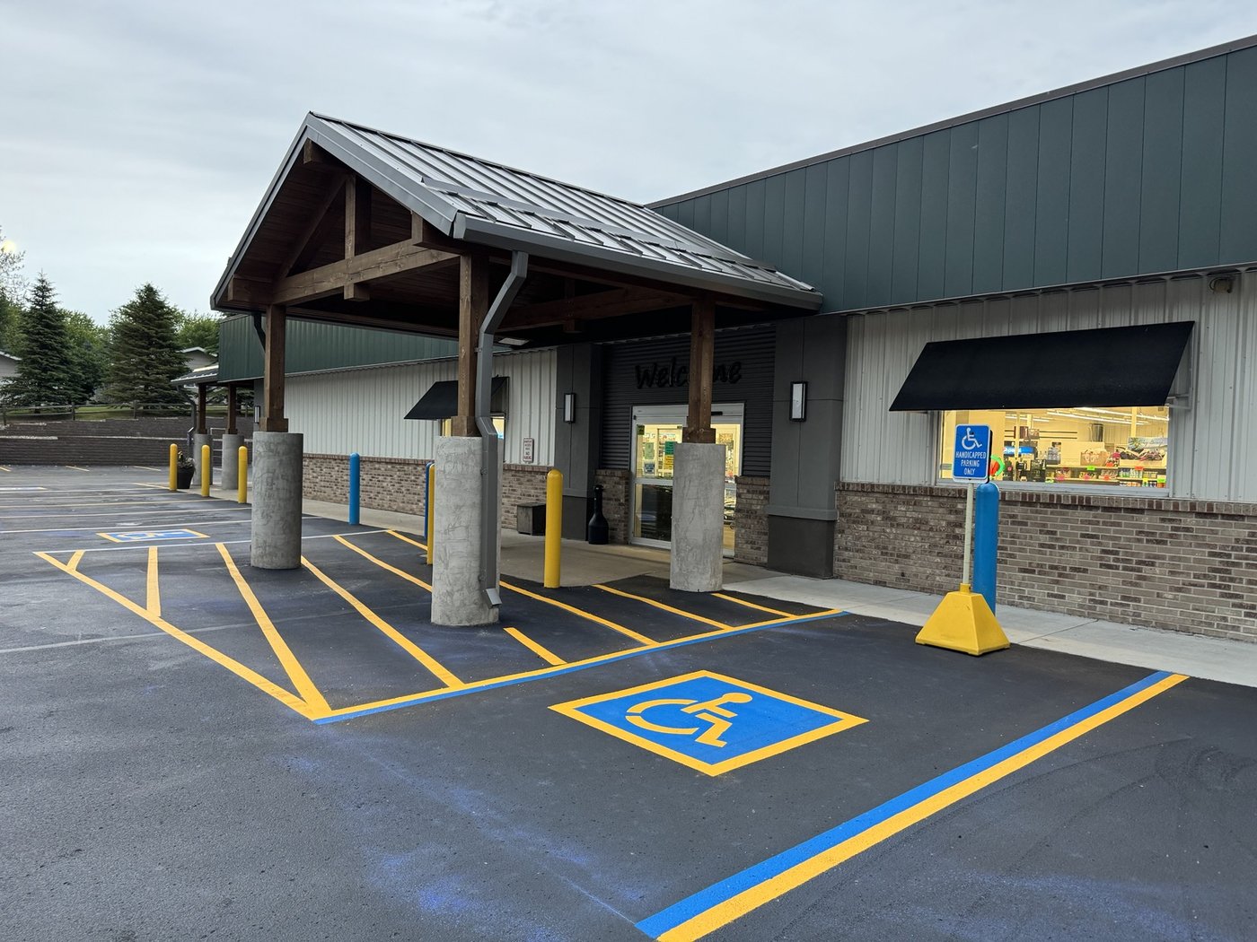 Grocery store entrance with covered drive-up